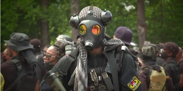 Heavily armed black militia marches through suburban city, demands reparations from whites